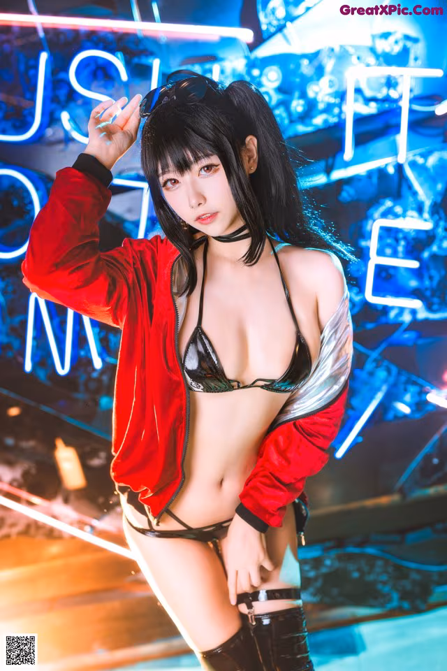 A woman in a bikini posing in front of a neon sign.
